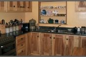kitchen in spalted ash with tan brown granite worktop